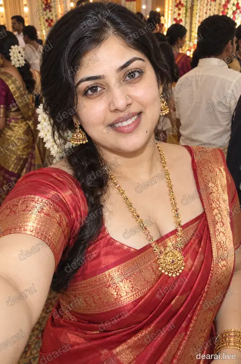 Revathi · Wedding selfie, red silk · 2026-09-18